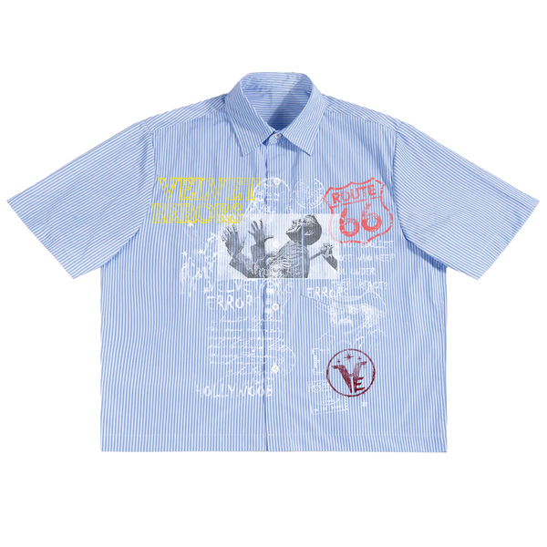 Blue Route 66 button-up shirt by Velvet Errors, featuring classic collar and front buttons, displayed on a plain background.