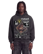 Black Feral Hoodie by Velvet Errors displayed on a person, showcasing the relaxed fit and stylish design of the hoodie.