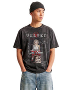Velvet Errors Rockstar Wash Tee in black, featuring a casual fit and graphic design, displayed on a model posing confidently.