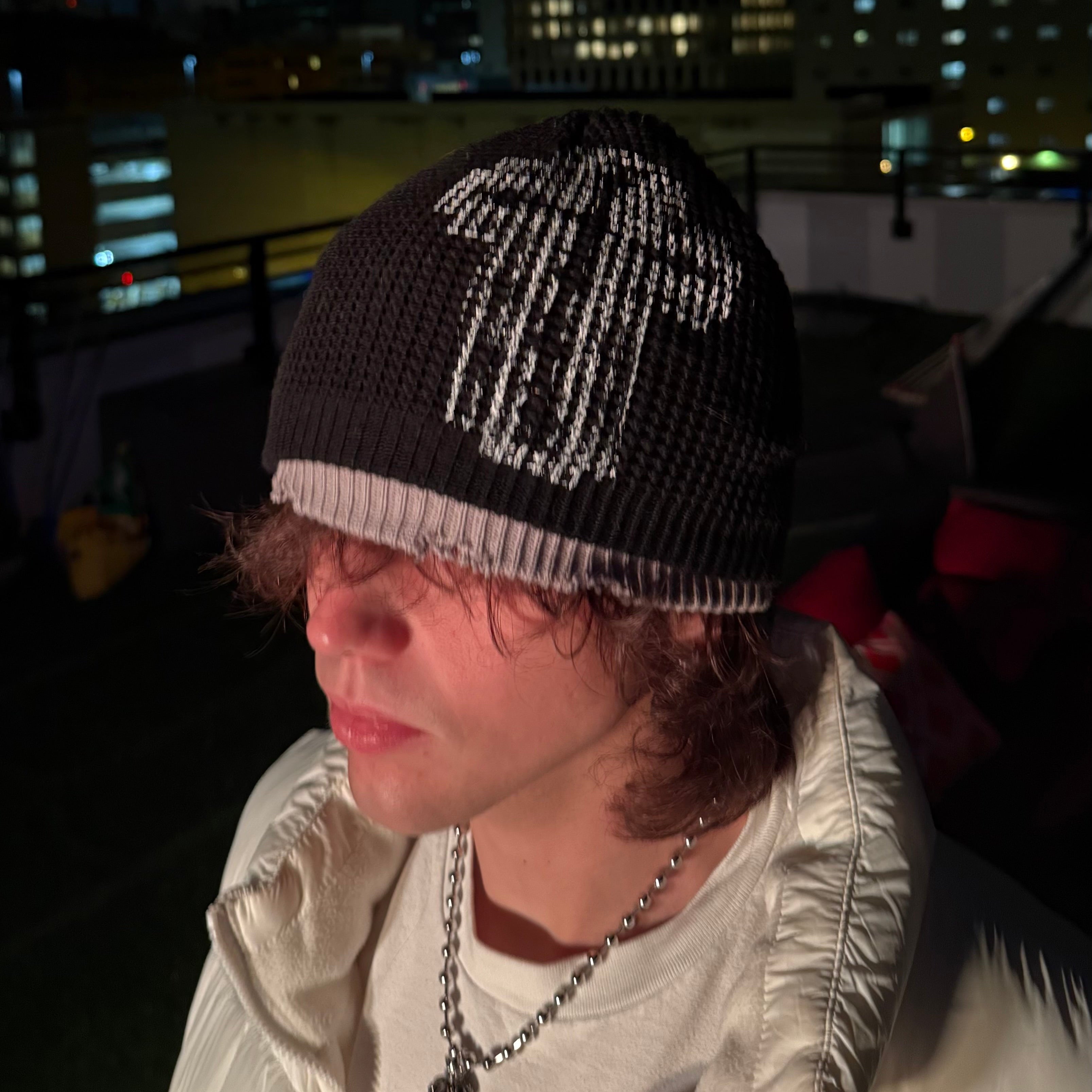 Velvet Errors Razor Double Beanie in soft knit fabric, featuring a folded brim and branded tag for a stylish, cozy look.