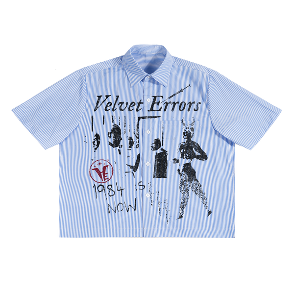 Velvet Errors 1984 button-up shirt in black fabric, featuring a classic collar and button closure, displayed flat.
